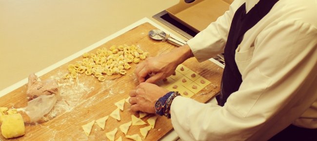 Fold the squares of pasta over the filling to obtain little triangles, roll them over your finger tip and press to close the tortellino.