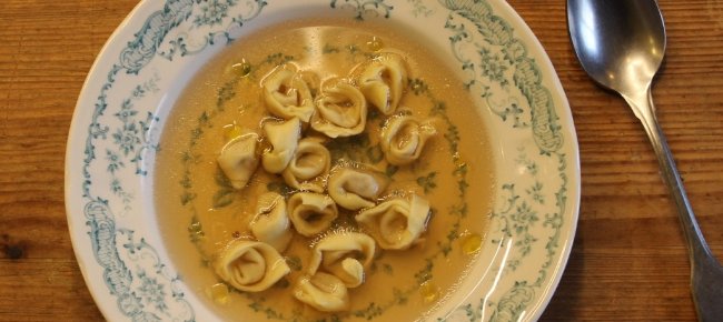 Season the broth with salt and boil the tortellini
